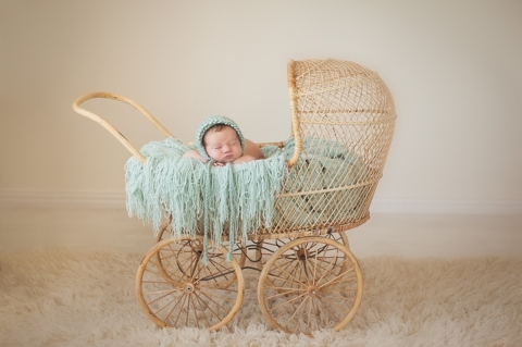 newborn baby girl in carriage photo