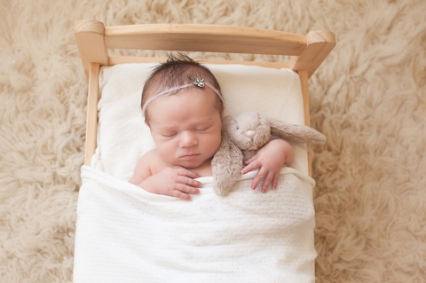 newborn baby in bed photo