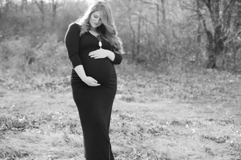 black and white maternity photo in a field