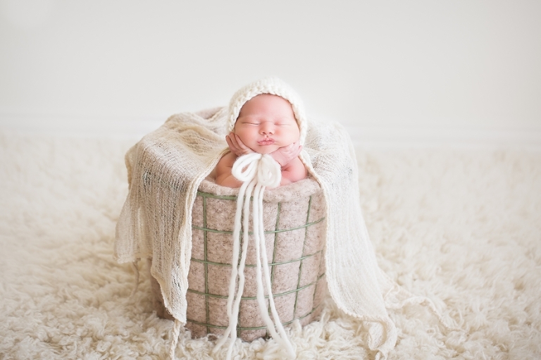 newborn baby girl session with baskets and wool fillers